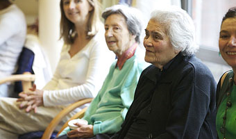 row of 4 people sitting down